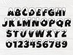 the letters and numbers are drawn with black ink on white wood grained paper,