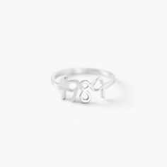 Size GuideSafety PolicyCare InstructionsThe Pixie Name Ring in Silver is a bespoke piece that speaks for itself and is certain to make an impression. Although it is a dainty and minimalistic piece, it is oh so very impactful.Customize me!  With up to 6 characters to get creative with, be sure to check your spelling and formatting before submitting your order!How to make it yours?  Choose fun words such as bae or angel to create a playful look.How To Wear It: We love to stack this ring with other Pixie Names, Name Rings Silver, Fun Words, Word Ring, 6 Characters, Name Ring, Name Rings, Birthday Ring, Gold Gift