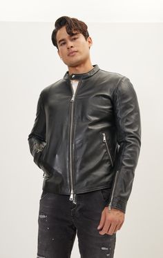 DETAILS Introducing the timeless elegance of our Classic Cafe Racer Leather Jacket. Featuring 10-gauge YKK zipper cuffs and side pockets, this jet black masterpiece is crafted from a thicker matte leather for durability and a distinctive aesthetic. The snap button neck fastener adds a touch of vintage flair, making this jacket a true symbol of enduring style and sophistication. Embrace the legacy of the open road with this iconic Cafe Racer jacket.- Perfectly coordinated with the N° 2475 GENUINE LAMBSKIN LEATHER PANTS, creating a harmonious ensemble that exudes sophistication. SIZE + FITTailored fit, to find your correct size use the '' what's my size '' button. Fit model wears an L (40 US), his measurements: chest 40"/ neck 16.5" / height 6'2"/ weight 175lbs. COMPOSITION 100% LeatherMade Classic Black Leather Jacket For Work, Black Biker Jacket With Zip Cuffs For Work, Classic Black Outerwear With Zip Cuffs, Black Leather Jacket With Zip Cuffs For Business, Black Business Leather Jacket With Zip Cuffs, Modern Black Biker Jacket For Formal Occasions, Modern Black Leather Jacket For Formal Occasions, Black Leather Jacket With Zipper For Work, Black Leather Jacket With Zip Cuffs For Work