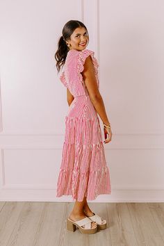 - Stroll through the farmer's market in this darling dress! - Lightweight material with a stripe pattern - A v-cut neckline - Short flutter sleeves - Pleated detail - A low cutout detail - A built-in skirt lining - Hidden side pockets - A flowy yet flattering silhouette that ends in a maxi length hemline V-neck Dress With Vertical Stripes For Day Out, Spring Striped Dresses With Ruffles, Striped Short Sleeve Dress With Ruffles, Spring Striped Dress With Ruffle Hem, Striped Ruffle Hem Dress For Vacation, Striped Dress With Ruffle Hem For Vacation, Striped V-neck Lined Dresses, Pink Vertical Stripe Summer Dress, Pink Vertical Striped Summer Dress