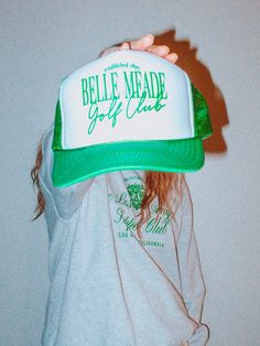 Show off your love for the Golf Course in our new 90's inspired Belle Meade Golf Club trucker hat.- Features the phrase "Belle Meade Golf Club" all in a green ink - Individually heat pressed onto each hat- 5 Panel, Mesh Back with Snap Back*due to screens & filters colors may vary slightly to photos* Retro Trucker Hat For Baseball Season Streetwear, Vintage Green Trucker Hat For Streetwear, Retro Trucker Hat With Letter Print For Sports, Retro Letter Print Trucker Hat For Sports, Retro Green Baseball Cap With Letter Print, Green Retro Baseball Cap With Letter Print, Green Snapback Hat With Letter Print For Streetwear, Green Letter Print Snapback Hat For Streetwear, Retro Trucker Hat With Letter Print For Streetwear