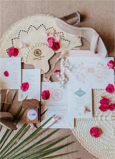 the wedding stationery is laid out on the floor