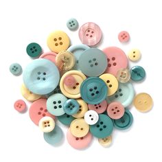 a pile of multicolored buttons sitting on top of each other