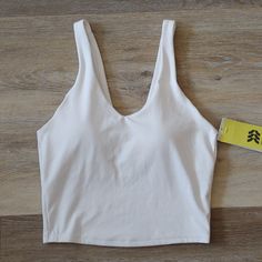 Brand New With Tags. See All Pics For Details And Measurements. Size: Xs Fitted V-neck Sports Bra For Yoga, Sporty V-neck Loungewear Activewear, Solid V-neck Activewear For Spring, Sporty V-neck Activewear, Sporty Tops With Built-in Bra And Scoop Neck, White Athleisure Top With Built-in Bra, Seamless Stretch V-neck Activewear, Sporty Tank Crop Top For Loungewear, Fitted Crop Top For Summer Fitness