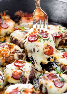 a fork is being used to eat some pizza rolls with cheese and pepperoni on them