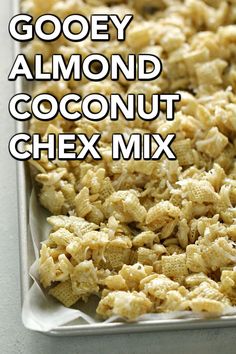 gooey almond coconut chex mix in a baking pan with the words gooey almond coconut chex mix