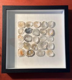 a shadow box with some rocks in it