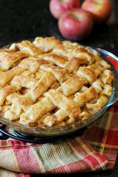 an apple pie sitting on top of a table