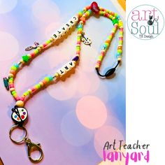 A unique and fun way to show off your Art teaching skills with this fun handmade beaded lanyard! Product Details: ❤️ Perfect for Teachers or someone who loves to create! 🎨 ❤️ Available Size:  Standard: 19 inches Long: 23 inches ❤️ Handmade: Nylon String, Beads, Silicone Bead, and Breakaway Clasp Fun Beaded Craft Supplies For Gifts, Personalized Round Beads For Crafting, Artistic Adjustable Beaded Necklace With Round Beads, Adjustable Multicolor Novelty Craft Supplies, Fun Adjustable Lanyards For Personal Use, Novelty Multicolor Craft Supplies For Personal Use, Personalized Multicolor Craft Supplies For Gift Making, Handmade Novelty Craft Supplies For Personal Use, Playful Multicolor Customizable Craft Supplies