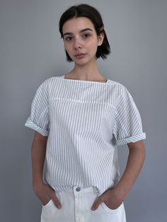 Editor's Notes The blouse has subtle stripes for a fresh mood. - Square neckline that covers the bust- Casual and harmonious mood- Puff sleeves- Refreshing texture fabricMeasurements(in.)ONE SIZE- Length: 24.61 in. - Chest: 20.47 in. - Armhole: 11.42.in. - Sleeve Length: 11.61 in. - Sleeve Width: 8.27 in. - Shoulder: 15.75 in.*The sizes may be vary by ±0.39-0.79 in. depending on the method and location of measuring*The exact color may vary depending on the screen resolutionModel info: Olena - Height 5' 8'', 112 lbs, Top 44, Bottom 27, Shoes KR 250mmComposition & Care- 100% Cotton- Dry cleaning recommended for the first wash- If washing later, wash in lukewarm water- Store jackets in a cloth hanger- Fold the sweaters to store- Due to the nature of the fabric, there may be White Vertical Stripes Blouse For Spring, Summer Top With Striped Collar, Summer Daywear Top With Striped Collar, White Blouse With Vertical Stripes For Summer, White Summer Blouse With Vertical Stripes, White Vertical Stripes Blouse For Workwear, White Blouse With Vertical Stripes For Work, White Vertical Stripes Top For Spring, White Tops With Vertical Stripes For Spring