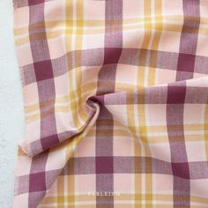 a pink and yellow checkered fabric