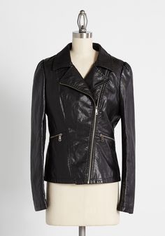 If you are looking for your next biker babe statement piece, look no further than this classic black vegan leather moto jacket. True to form, this jacket showcases all the features you love, like an offset closure, zippered pockets, and an exaggerated notched lapel. Knit panels at the sleeves offer additional flexibility to this rock-and-roll, hip-length biker jacket. Shell: 100% Polyurethane. Underlay: 100% Viscose. Lining: 100% Polyester. Wipe clean. Side pockets with zipper closure. Fully lin Vintage Style Swimwear, Faux Leather Outfits, Gingham Embroidery, Motorcycle Jacket Women, Biker Babe, Casual Dresses Plus Size, Midi Dress Plus Size, Tunic Hoodie, Enjoy The Ride