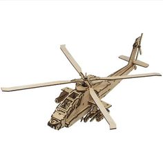 a wooden model of a helicopter flying in the sky