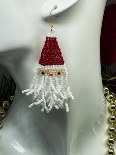 Celebrate the Christmas season in style with these adorable Santa curly beard fringe earrings, a perfect festive charm accessory. Designed to spread holiday joy wherever you go. Lightweight and fun to wear, making them a must-have accessory for the holiday season. They are 3 inches in length with 18K gold plated ear wires. Christmas Fringe Earrings, Christmas Seed Bead Fringe Earrings, Santa Fringe Earrings, Santa Beaded Earrings, Beaded Santa Earrings Pattern, Curly Beard, Christmas Apparel, Beaded Fringe Earrings, Reno Nv