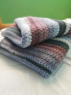 two crocheted blankets folded on top of each other