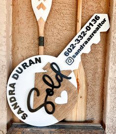 two paddles are hanging on the wall next to a sign that says jordan and love