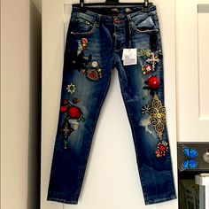 Fashion Jeans, Wow Your Friends By Wearing This Statement Jewelry Jeans. Size 26 Low Rise, Elastic. Fits 1 Size Bigger Ideal For Size 27. New With Tags! Cheap Embellished Jeans For Spring, Embellished High Rise Denim Jeans, Bohemian Denim Jeans With Patches, Spring Denim Jeans With Graffiti Print, Embroidered Low Rise Jeans, Bling Clothes, Luxury Floral Embroidery Jeans For Women, Disney Sparkle, White Ripped Jeans