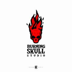 the logo for burning skull studio, which is designed to look like a demon's head