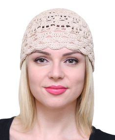 a woman with blonde hair wearing a crochet headband and pink lipstick on her lips