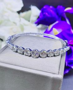 A gorgeous and huge high-end luxury fine earth mined natural WHITE diamonds, in MODERN STYLE, bangle handmade from solid 18K White gold. This elegant and oh so pretty bangle is a timeless piece and is in BRAND NEW condition. With 15 pieces of HUGE diamond, TOP sparkling, and CLEAN quality. And wraps the wrist perfectly. It is so excellently made and feels so lovely on, you forget you are wearing it - until someone reminds you, it certainly gets A LOT OF ATTENTIONS! The bangle contains 15 round b Luxury Classic Diamond White Bangle, Luxury White Jubilee Bracelet Bangle, Luxury Timeless Diamond White Bangle, Timeless Diamond White Bangle Bracelet, Luxury White Bangle With Diamond Accents, White Gold Bangle, Handmade Bangles, Vs Diamond, Bangles Jewelry