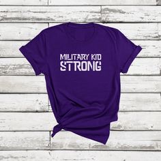 Purple up in April to show your support of Month of the Military Child! It's easy to show love for Military Kids in this purple shirt. You may also be interested in --> https://www.etsy.com/shop/hellomurphy/?search_query=military >>IMPORTANT NOTES<< Please contact me within 7 days of order receipt if there are any print issues. >>PRODUCT FEATURES<< This premium shirt feels soft and lightweight, with just the right amount of stretch. The unisex cut is flattering for both men and women. Please con Purple Cotton Graphic Tee Shirt, Purple Crew Neck Shirt With Screen Print, Purple Cotton T-shirt With Letter Print, Purple Graphic Tee With Screen Print, Purple Casual Top For Awareness Events, Casual Purple Top For Awareness Events, Purple Short Sleeve Shirt With Letter Print, Purple Crew Neck Top With Name Print, Purple Short Sleeve T-shirt With Text Print