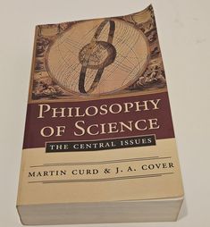 a book that is sitting on top of a white surface with the title, philosophy of science