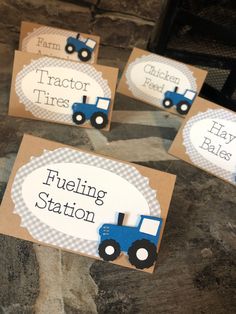 four place cards with tractors on them