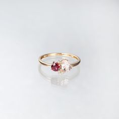 two stone ring sitting on top of a white surface