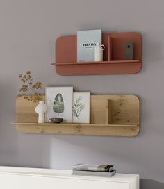 two wooden shelves on the wall above a white dresser