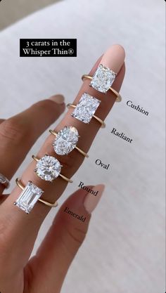 a woman's hand with five different engagement rings on it and the words 3 carats in the whisper thing