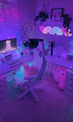 a room with purple lighting and a white chair in front of a computer desk that has a pink stuffed animal on it