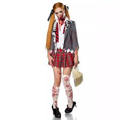 a woman dressed up as a zombie with blood on her face and legs, holding a broom