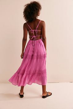 Just as effortless as it is versatile, this wear-everywhere maxi from our free-est collection is featured in a billowy, tiered silhouette with smocked detailing at the bodice and front tie detailing for added dimension. * Open back design * Adjustable, tie-back style * Lined | Taking Sides Maxi Dress by free-est at Free People in Pink, Size: L Bohemian Tiered Maxi Dress With Tie Back, Tiered Maxi Dress With Smocked Back And Flowy Skirt, Bohemian Ruched Tiered Skirt Maxi Dress, Breezy Midi Maxi Dress With Ruffle Hem, Summer Maxi Tiered Dress With Smocked Back, Summer Maxi Length Tiered Dress With Smocked Back, Vacation Tiered Maxi Dress With Smocked Back, Tiered Maxi Dress With Tie Back, Tiered Midi Dress With Tie Back For Beach