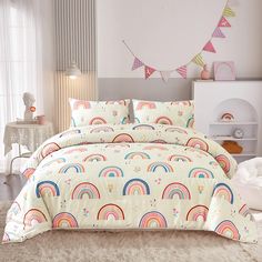 a bed room with a neatly made bed and a rainbow comforter set on it