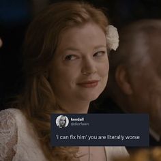 an older man and young woman sitting next to each other