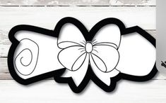 a paper cutout of a bow with the word love on it and an image of a