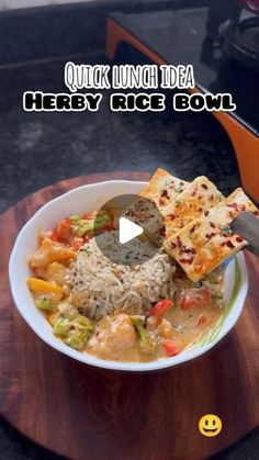 a bowl filled with food on top of a wooden table