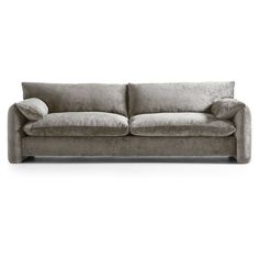 a grey couch sitting on top of a white floor