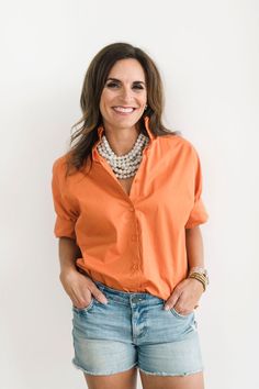 This burnt orange blouse is a versatile and chic top that adds a fresh pop of game day color to any outfit. Whether dressed up or down, it is the perfect addition to your wardrobe.. Crisp burnt orange-hued cotton Oversized fit (Recommend sizing down, see fit notes below) Exaggerated classic cuff Ruffled stand-up collar Button front Ruffle Collar Shirt, Chloe Dress, Romper And Jacket, Orange Blouse, Jumpsuit Jacket, Stand Up Collar, Ruffle Shirt, Chic Top, Ruffle Collar