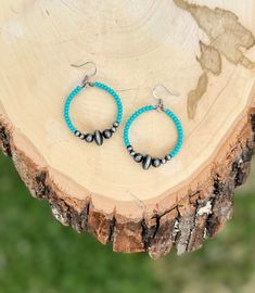 Turquoise Navajo style hoop earrings. Handmade with glass turquoise seed beads, Navajo style faux pearls, and stainless steel wire. The faux pearls give these earrings the beautiful style of Navajo without the weight. They are super light and petite. Perfect for a minimalist western or boho look.  Length 2 inches Width 1 1/4 inches **Earrings Only** Please message me if you have any questions. Thank you for visiting my shop! Happy Hanging! Turquoise Beaded Earrings With Small Hoop, Southwestern Turquoise Nickel-free Hoop Earrings, Turquoise Southwestern Nickel-free Hoop Earrings, Southwestern Turquoise Hoop Earrings Nickel Free, Turquoise Nickel-free Small Hoop Beaded Earrings, Adjustable Turquoise Hoop Earrings For Festival, Minimalist Western, Rodeo Jewelry, Jewelry Western