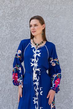 "Feel like a bohemian queen in this eccentric and beautiful embroidered tunic dress. The dress is made of Linen and Egyptian cotton which is widely renowned for its quality and texture. The dress is light and extremely soft and can be used on many occasions - beach, lounge, or even in your home to feel comfortable. Fabric : 80% Linen; 20% Egyptian Cotton. Tunic measurements in inches : Small (Size 4/6 USA) Bust : 36-37 Hip : 40-41 Medium (Size 8/10 USA) Bust : 39-40 Hip : 45-46 Large (Size 12/14 Blue V-neck Dress With Resham Embroidery, Blue Resham Embroidered Maxi Dress, Blue Maxi Embroidered Dress With Intricate Embroidery, Blue Embroidered Maxi Dress With Intricate Details, Blue Maxi Dress With Resham Embroidery, Blue Maxi Embroidered Dress With Intricate Details, Traditional Blue Dress With Embroidered Sleeves, Long Sleeve Embroidered Dress With Geometric Embroidery, Long Sleeve Embroidered Dress With Geometric Design