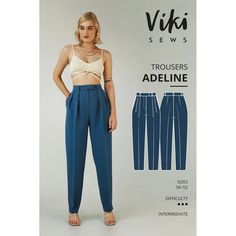 a woman wearing blue pants and a tank top in front of an advertisement for the new line