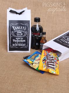 an assortment of snacks and condiments sitting on a table next to a bag