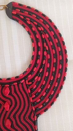 SALE African Choker necklace, Leather choker necklace, Zulu necklace, Beaded necklace, Adjustable necklace, Women jewelry, An authentic elegant necklace that can match with any outfit. 100% handmade Closure: hooks Color: Black and Red. Available in different colors. 3-5 days delivery via DHL Express The shipping fee is for the first item only and additional necklaces or items ship for free.Buy multiple items and pay shipping for 1 item only.The rest ships free.) Wholesale available at a fair pri Traditional Red Necklaces With Black Beads, Traditional Red Necklace With Black Beads, Bohemian Red Necklace With Black Beads, Adjustable Red And Black Beaded Necklace, Handmade Red Beaded Choker Necklace, Adjustable Red Beaded Necklace With Black Beads, Red Beaded Necklaces As A Gift, Traditional Red Necklace With Tiny Beads, Red Beaded Choker As Gift