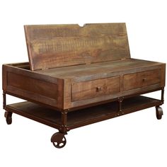 an old wooden bed with wheels and drawers on the bottom, sitting in front of a white background