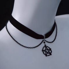 Unveil your inner enchantress with our Mystic Velvet Pentagram Choker. Crafted from luxurious black velvet, this choker features a striking pentagram pendant as its centerpiece. Enhancing its dark elegance, delicate chain accents drape gracefully, adding an extra layer of sophistication and edge. Pentagram Choker, Pentagram Design, Black Velvet Ribbon, Steampunk Fashion Male, Dark Elegance, Pentagram Pendant, Gothic Skirts, Black Velvet Choker, Black Choker Necklace