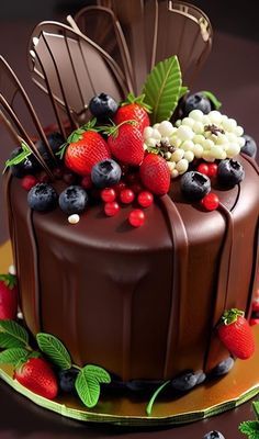 a chocolate cake topped with berries and cherries