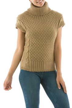 Susi Sillau designs a sweater of flirty elegance knit of a soft alpaca blend for extraordinary warmth. The chic beige sweater features a cozy turtleneck and short sleeves. Knit Short Sleeve Sweater For Fall, Knit Sweater With Short Sleeves For Fall, Short Sleeve Knit Sweater For Fall, Brown Short Sleeve Sweater For Fall, Winter Knit Sweater With Short Sleeves, Brown Knit Short Sleeve Sweater, Brown Short Sleeve Knit Sweater, Stretch Knitted Short Sleeve Sweater, Short Sleeve Textured Knit Top For Winter