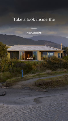 a house with the words take a look inside the new zealand in front of it