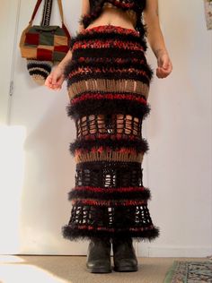 a woman wearing a skirt made out of knitted material